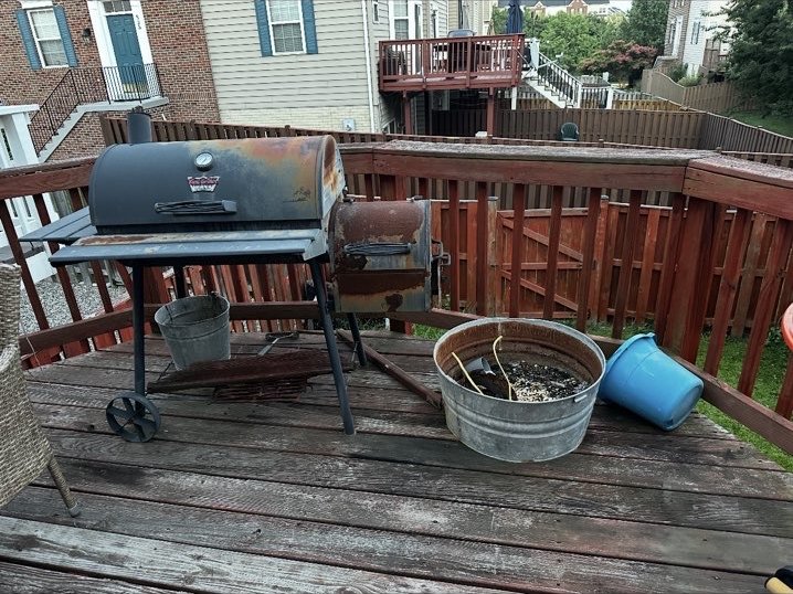 Deck before Muscle Hauling removed an old grill, planter, and outdoor items