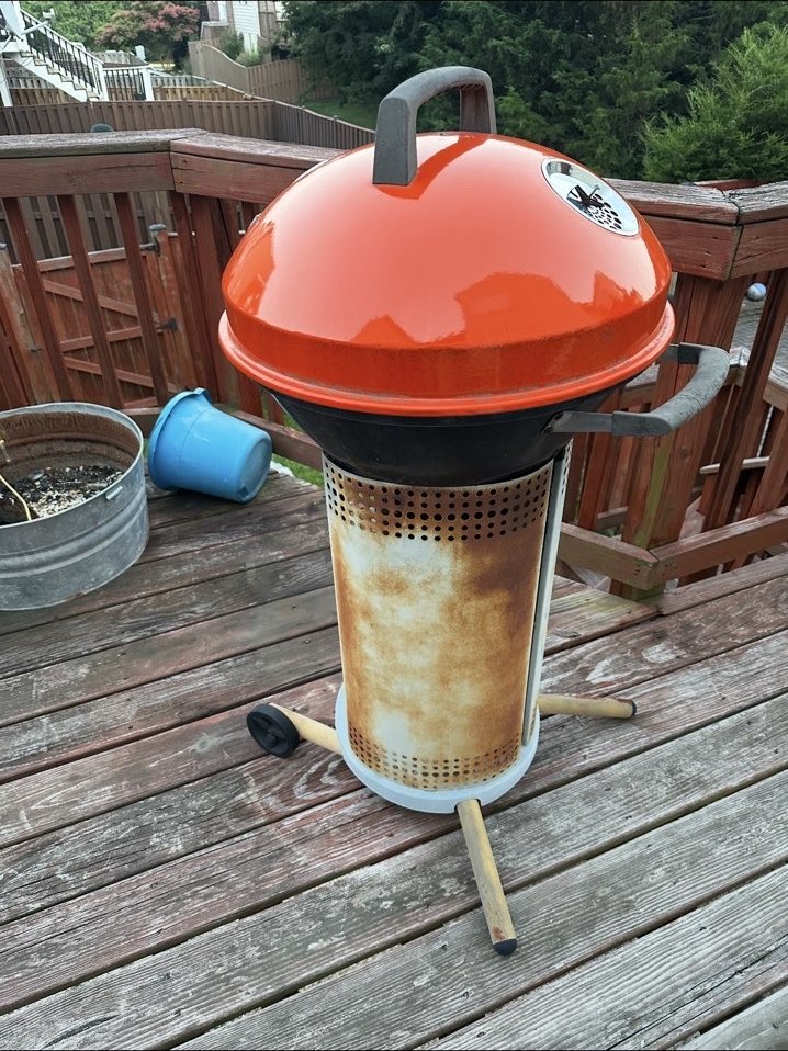 Large old kettle grill removed during an outdoor cleanout